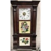 A 19th Century American walnut cased wall clock with enamelled dial and Roman numerals over two