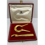 A Goldsmiths & Silversmiths for Asprey & Company Ltd gold plated two piece bottle opener set in