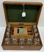 An oak cased medicine chest for "Davies & Shepheard Chemists 12 Bridge Street Row Chester",