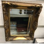 A circa 1900 moulded giltwood framed dome top mantel mirror,