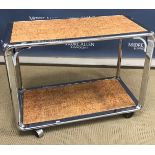 A mid 20th Century chrome drinks' trolley with cork effect inlaid shelves, 89 cm wide x 47.