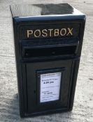 A modern reproduction postbox in black, 20 cm deep x 44 cm high