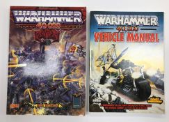 One volume "Warhammer 40,000 Vehicle Manual" and one volume "Warhammer 40,000 Rogue Trader" both