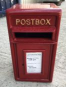 A modern reproduction postbox in red, 26 cm deep x 42 cm high