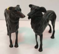 A bronze figure of a greyhound type dog 16 cm high together with another similar