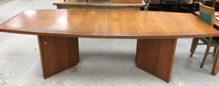 A d-Scan of Singapore teak boardroom table of shaped rectangular form on twin arrow head supports,