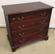 A modern mahogany chest of four long drawers in the Georgian style raised on bracket feet 99 cm wide