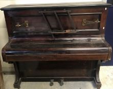 A circa 1900 mahogany cased upright pian
