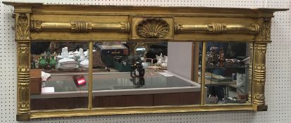 A 19th Century gilt and gesso framed tri
