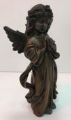 A modern bronze figure of a praying ange