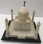 A white alabaster model of the Taj Mahal