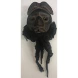 A West African "Dan" mask with real hair