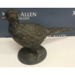 A modern cast metal model of a pheasant