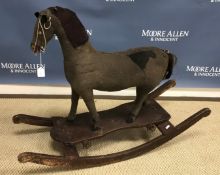 A 19th Century upholstered rocking horse