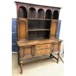 A mid 20th Century oak dresser, the boar