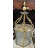 A brass hexagonal lantern with glass pan