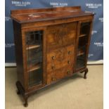 A mid 20th Century burr walnut veneered