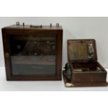 A mahogany cased therapy unit with three