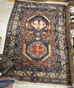 A Caucasian rug, the central panel set w