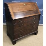 A 19th Century oak bureau, the plain top