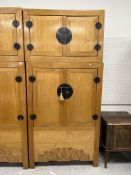 A Chinese elm cupboard or wardrobe in tw