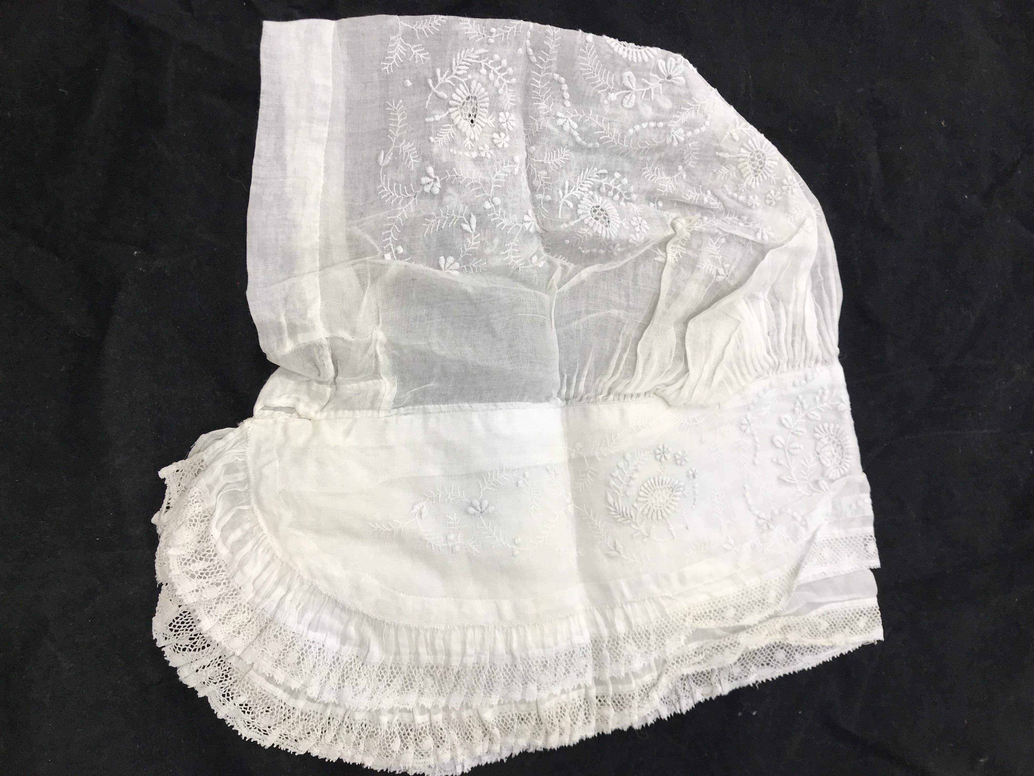 An 18th Century lace decorated floral co