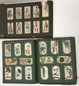 Three albums of various cigarette cards