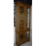 A modern oak glazed four door display ca