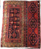 A Caucasian rug, the main panel set with