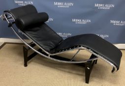 A modern chrome framed chaise after the