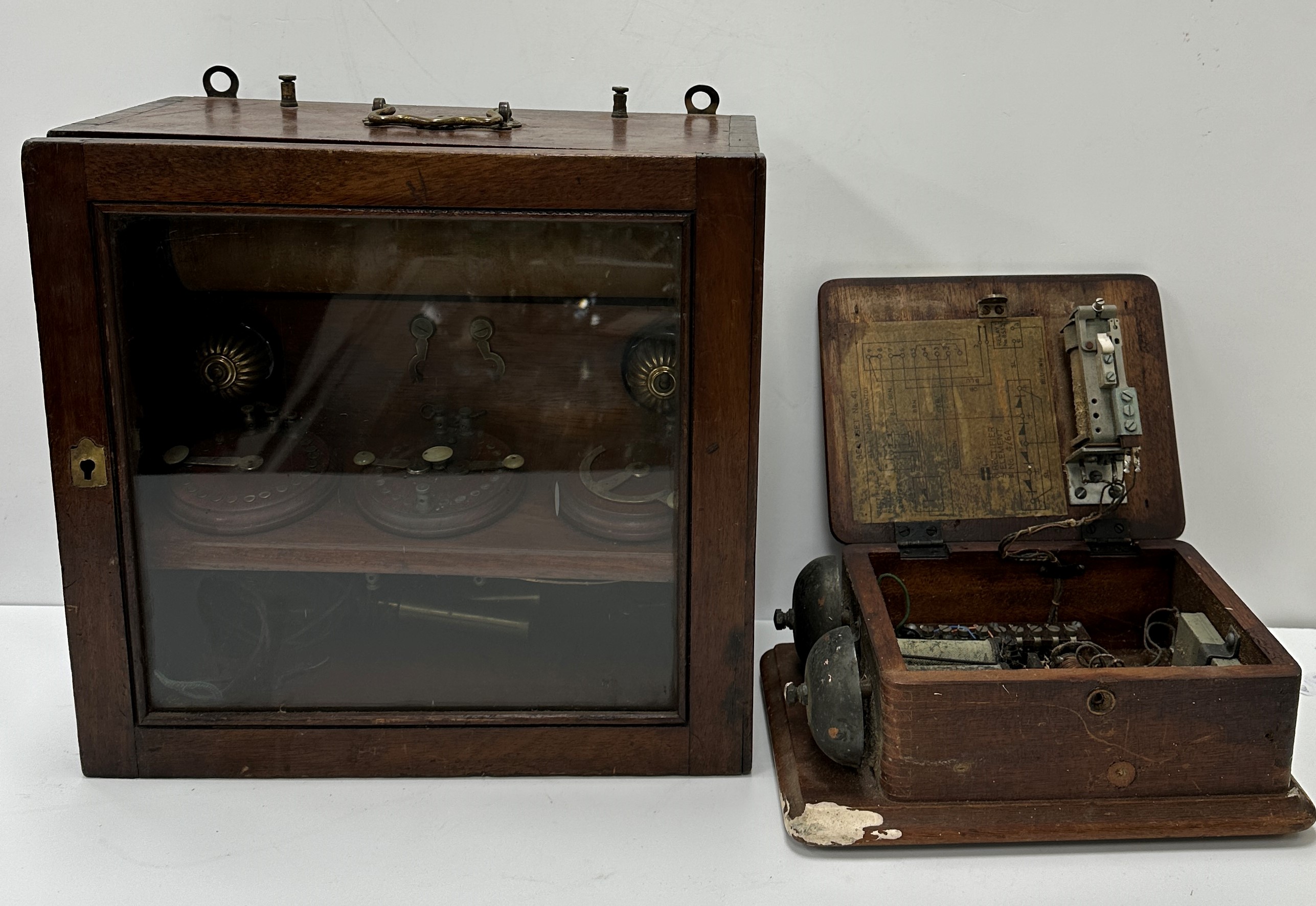 A mahogany cased therapy unit with three