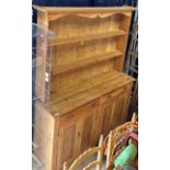 A modern pine dresser, the boarded two t