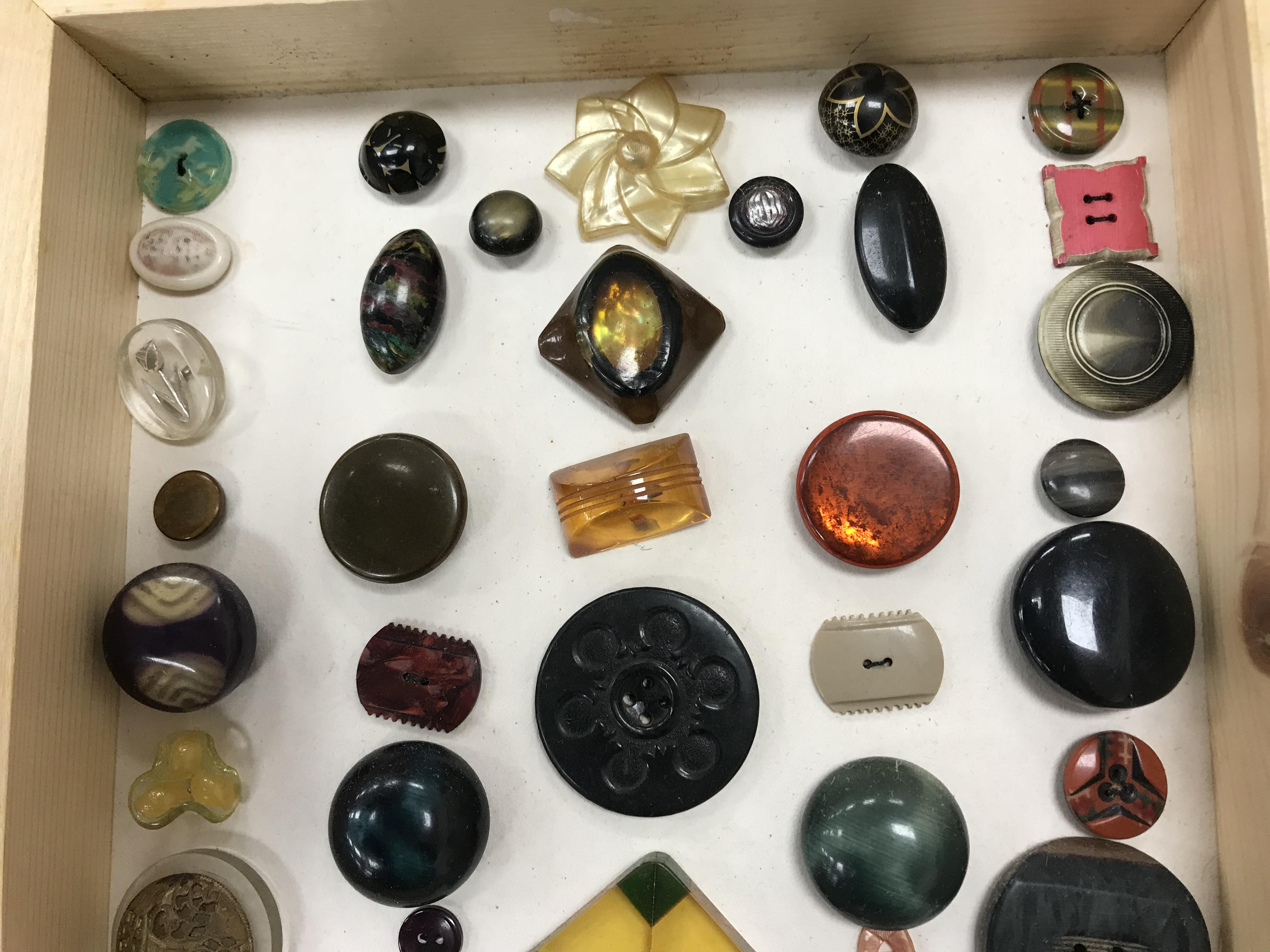 A framed collection of buttons in bakeli - Image 15 of 19