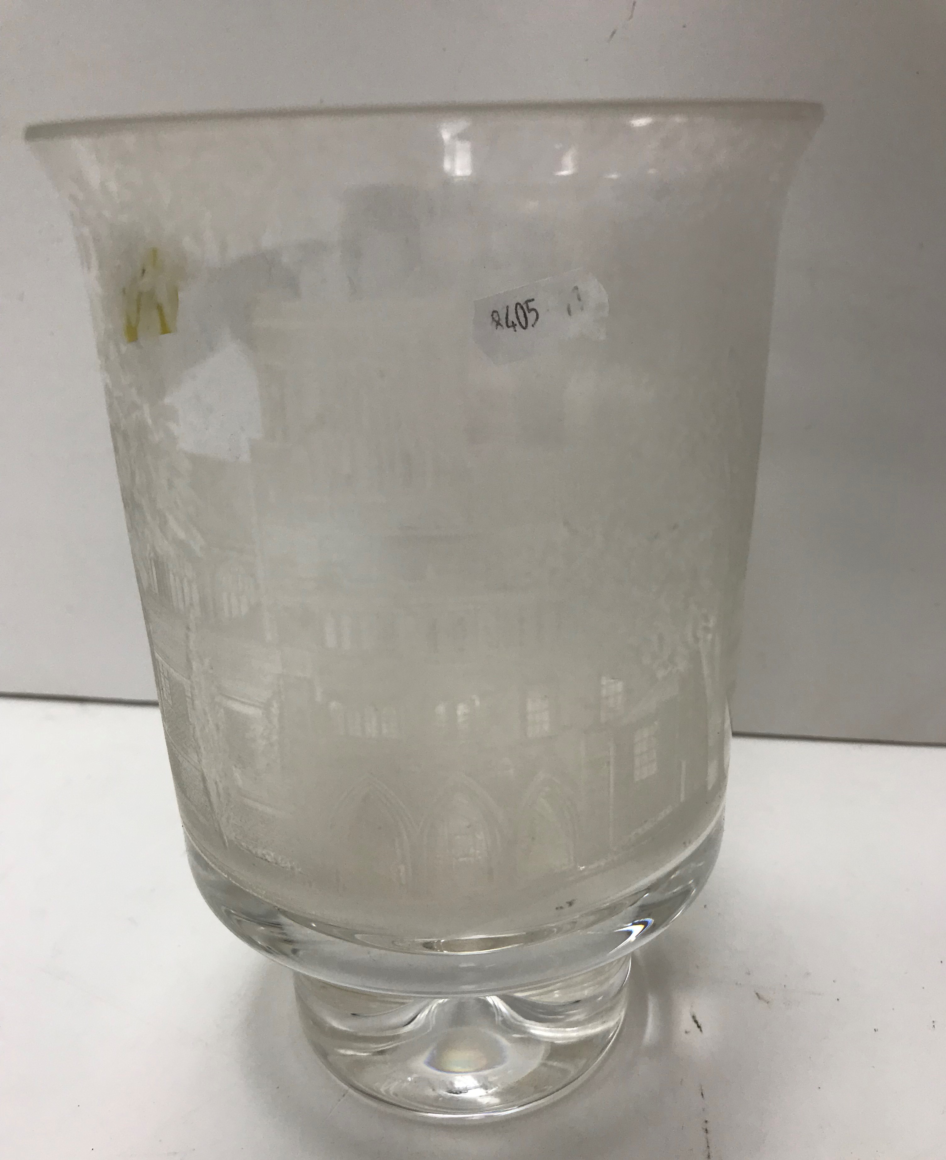 A modern engraved glass goblet depicting