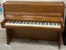 A mid 20th Century oak framed upright pi