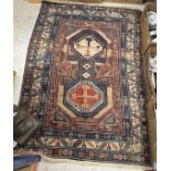 A Caucasian rug, the central panel set w