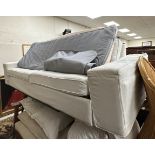 A modern upholstered sofa bed with cream