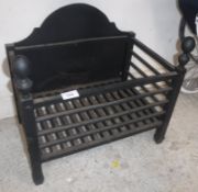 A modern cast iron fire basket of plain