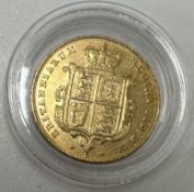 A yellow metal coin as a Victorian half