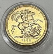 A yellow metal coin as an Elizabeth II s