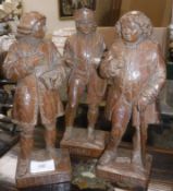 Three mid 20th Century carved wooden figures depicting Boswell inscribed "HC 1952",