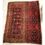 A Caucasian rug, the main panel set with