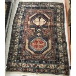 A Caucasian rug, the central panel set w