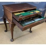 An early to mid 20th Century mahogany canteen table with two drawers enclosing Romney plated