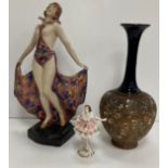 A Royal Dux figure of a 1930s dancer with flared multi-coloured skirt, impressed No.