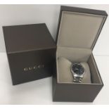 A Gucci stainless steel cased gent's wristwatch with black lattice work decorated dial and date