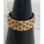 An 18-carat gold basketweave ring, size N, 5.