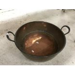 A Victorian twin-handled copper jam pan, 56 cm wide including handles x 19.