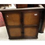 A circa 1900 oak and inlaid wall cupboard,