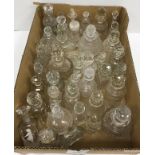 A large collection of late 19th / early 20th Century cut glass scent bottles / liqueur bottles,